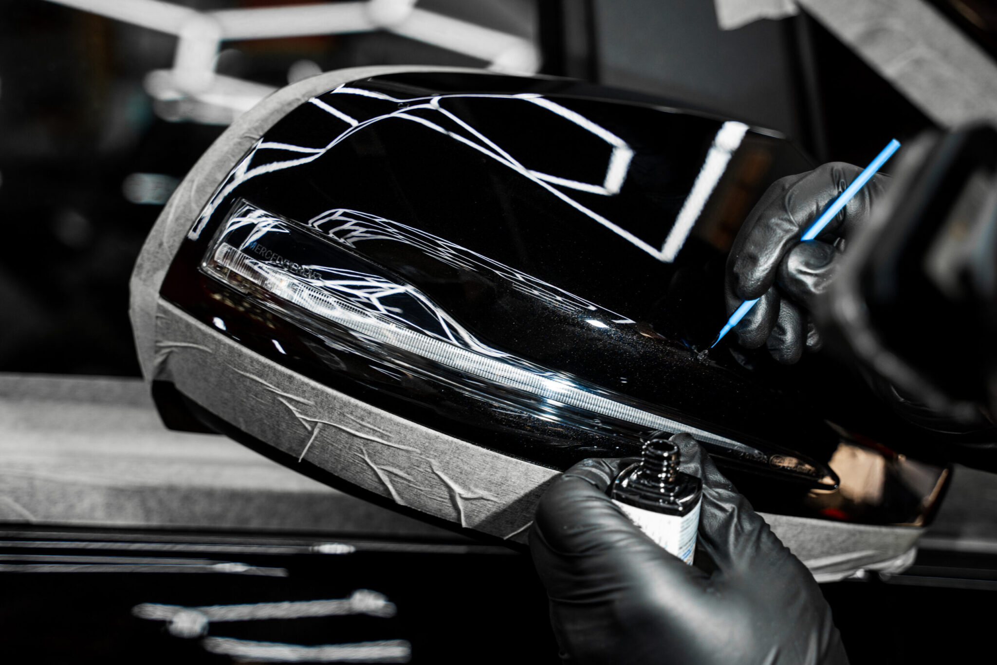 Touch up paint applying to car chip using fine micro brush to prevent rust and restores the car original look. Touch up detailing targets scratches and rock chips with exact color matching.